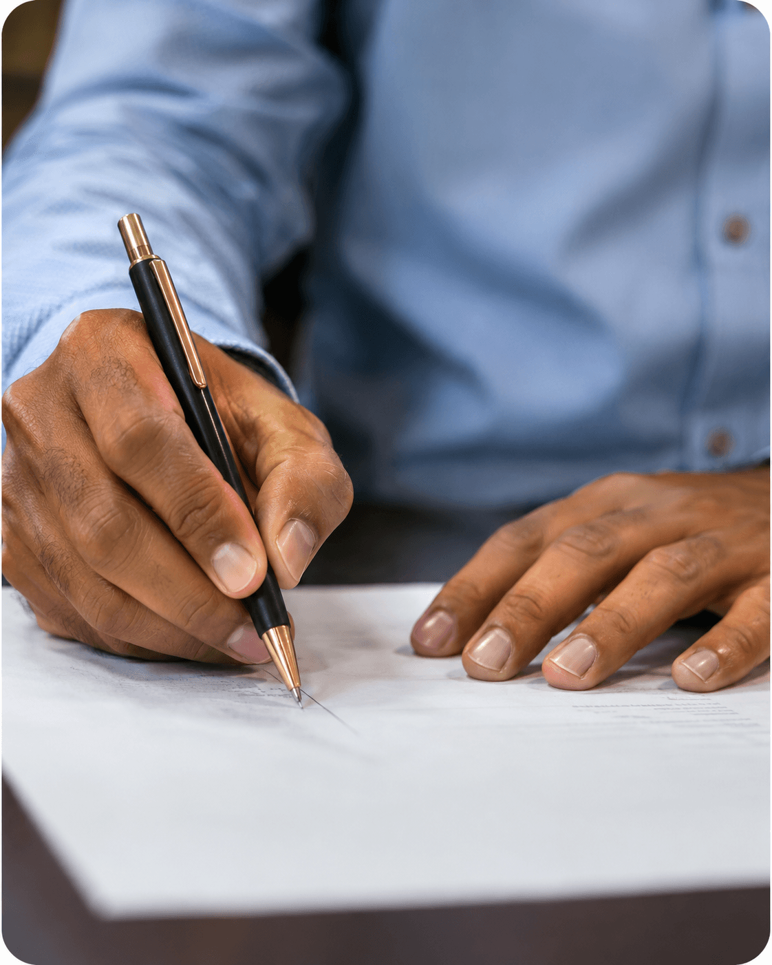 Person signing official documents and paperwork